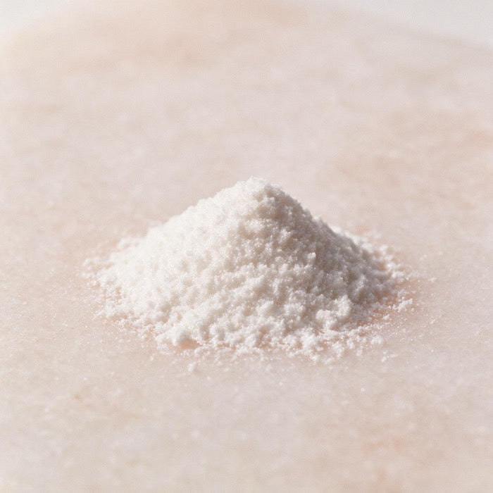 Fine white crystalline powder with a pearlescent shimmer